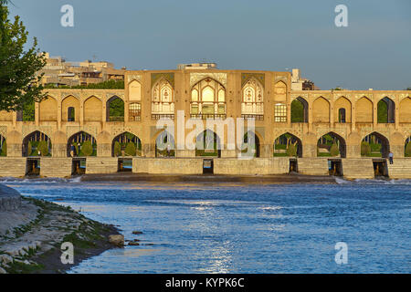 Isfahan, Iran - April 24, 2017: Central Pavilion of Khaju Bridge  over the Zayandeh river in bright sunshine at morning.  Bridge was built in the 17th Stock Photo