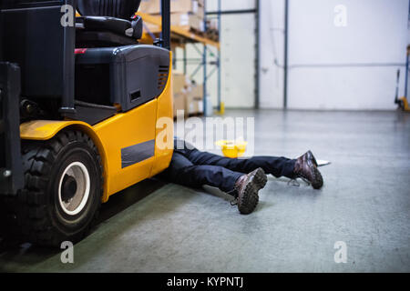 Warehouse worker after an accident in a warehouse. Stock Photo