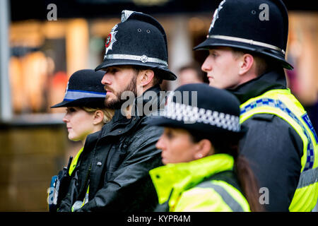 Monday 05 June 2017 Pictured: Police officers during a minutes  silence  Re: A vigil has been held in Swansea City Centre to remember the victims of the recent terror attack in London. Stand up to Racism Swansea have organised the event alongside Swansea Coalition Against War and Swansea PeopleÕs Assembly. Stock Photo