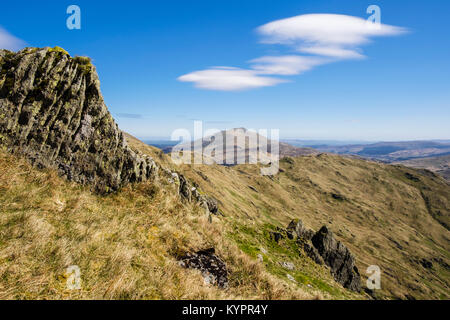 View to distant Moel Siabod from Y Lliwedd mountainside with Lenticular clouds (Altocumulus lenticularis) in Snowdonia National Park Wales UK Stock Photo