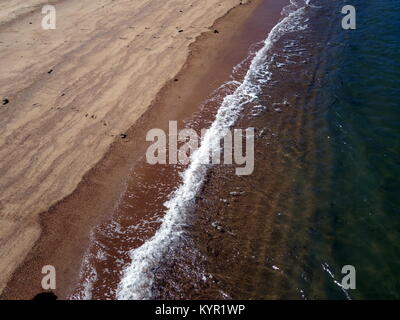 A tide line on a sandy beach Stock Photo