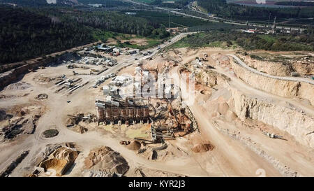 Large Quarry during work hours - Aerial image Stock Photo