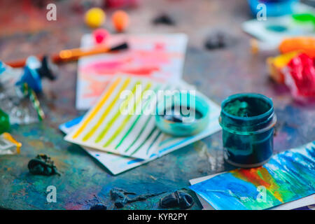 Artist tools in creative occupation concept. Brushes, watercolor swatches and paints. Artistic workplace. Stock Photo