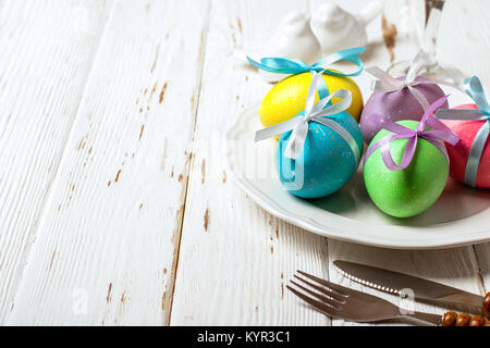 Spring Easter Table setting on white wooden table. Stock Photo