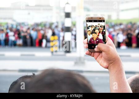 The streets of Doha can be colourful and full of life Stock Photo