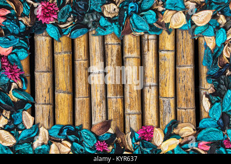 Beautiful and colorful background of Ocean Scent potpourri with copy space and a bamboo background Stock Photo