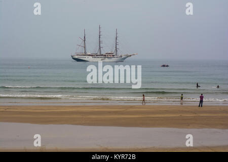 Cruise ship Sea Cloud II docked in the West bay Portrush, Northern Ireland on a misty summer afternoon on August 18th 2016. There are also some unknow Stock Photo