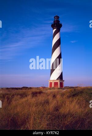 Cape Hatteras Lighthouse located on Hatteras Island in the Outer Banks in the town of Buxton, North Carolina and is part of the Cape Hatteras National Seashore. Built in 1802 the 210-foot height makes it the tallest brick lighthouse structure in the United States and 2nd in the world. Stock Photo