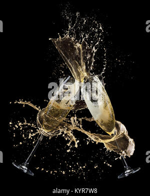 champagne splash from glasses on a black background. Stock Photo