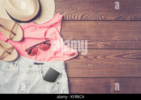 Casual female outfit on wooden table Stock Photo
