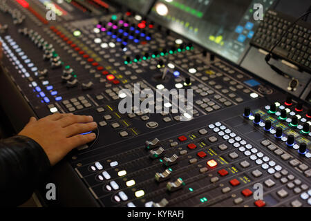 Close up view of digital audio production console. Selective focus. Stock Photo