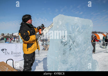 Ice carver at work at De Beers Inspired Ice Carving Championship at the annual Long John Jamboree winter festival held each March in Yellowknife, NWT. Stock Photo