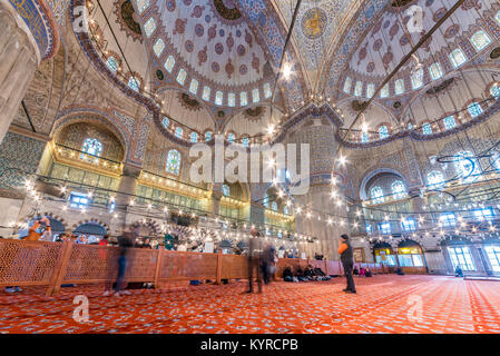 Muslim People praying in Blue Mosque also called Sultan Ahmed Mosque or Sultan Ahmet Mosque.ISTANBUL,TURKEY- MARCH 11, 2017 Stock Photo