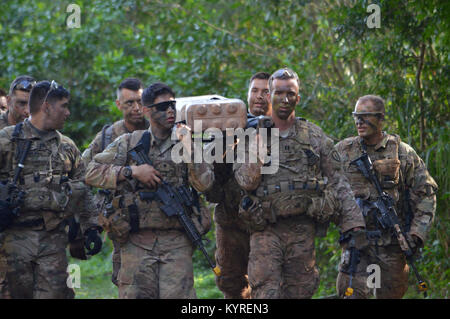 Soldiers assigned to the 3rd Brigade Combat Team, “Broncos,” 25th Infantry Division, carry a weighted litter on their march from East Range back to F Quad, Schofield Barracks, during Mungadai. The purpose of Mungadai event is to create, trained, and ready professionals, prepared with operational and foundational knowledge, to take disciplined initiative while implementing and executing their commander’s intent. (U.S. Army Stock Photo