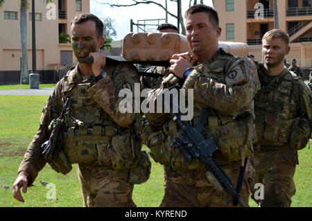 Soldiers assigned to the 3rd Brigade Combat Team, “Broncos,” 25th Infantry Division, arrive to F Quad, Schofield Barracks, after marching from East Range carrying a weighted litter during Mungadai, on Jan. 11, 2018. The purpose of Mungadai is to create, trained, and ready professionals, prepared with operational and foundational knowledge, to take disciplined initiative while implementing and executing their commander’s intent. (U.S. Army Stock Photo