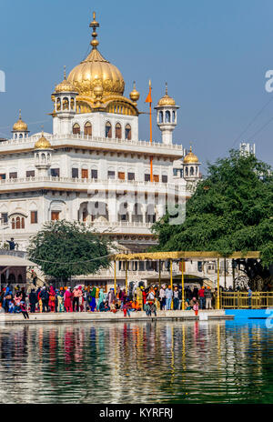 Akal Takht, Sikh Political Assembly building, Amritsar, India.  Reflections of white buildings of the Sikh religious authority on the water. Stock Photo