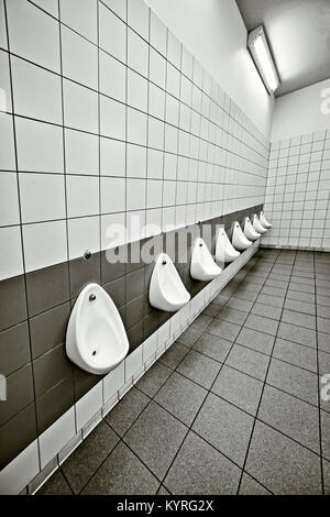 Urinals in public toilet restroom Texas USA Stock Photo - Alamy