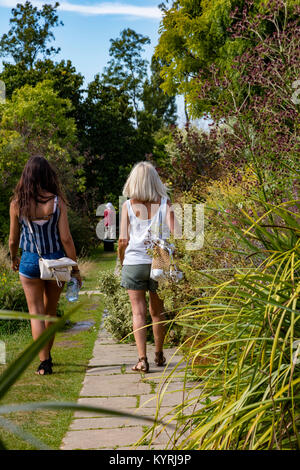 Visitors explore the gardens at Great Dixter, designed by Christopher Lloyd at Northiam, East Sussex, UK Stock Photo