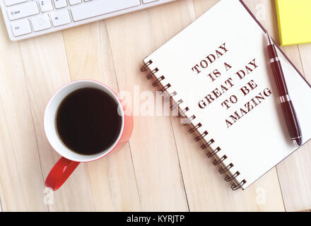 Inspirational quote on notepad - today is a great day to be amazing. Stock Photo