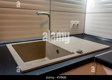 Granite sink and water faucet in new modern kitchen interior Stock Photo