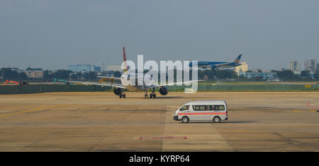 Phu Quoc, Vietnam - Dec 6, 2017. Vehicles on runway of Phu Quoc International Airport. Phu Quoc is a Vietnam island off the coast of Cambodia in the G Stock Photo