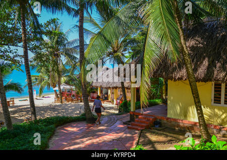 Phu Quoc, Vietnam - Dec 7, 2017. An eco-resort with palm trees in Phu Quoc, Vietnam. Phu Quoc is an island off the coast of Cambodia in the Gulf of Th Stock Photo