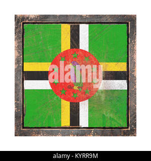 3d rendering of a Dominica flag over a rusty metallic plate in an old frame. Isolated on white background. Stock Photo