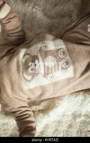 Woolen baby clothes. Woolen. Ecological clothes. Handmade. natural. Stock Photo