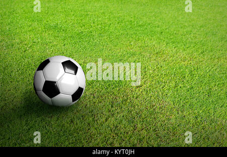 3D Rendered black and white soccer ball on green soccer football field background with copy space and grain processed Stock Photo