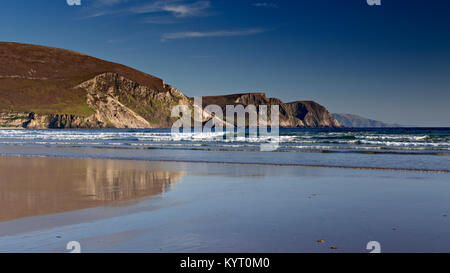 Cliffs reflecting in wet sand on Keel beach, Achill Island, Ireland Stock Photo