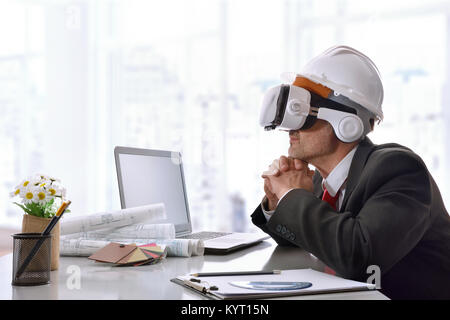 Architect watching 3d content in virtual reality glasses in the office. Horizontal composition. Stock Photo