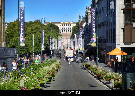 OSLO, NORWAY - AUGUST 18, 2016: People walk Oslo's main street Karl Johans at center with the Royal Palace in the background in Oslo, Norway on August Stock Photo