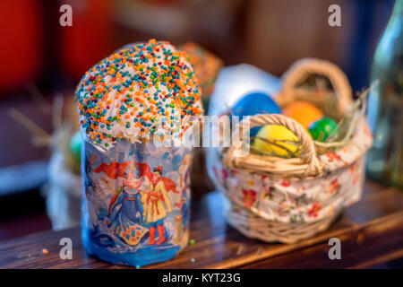 Orthodox easter cake and painted eggs on a table Stock Photo