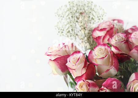 Beautiful bouquet of  red and white roses with baby's breath. Selective focus with shallow depth of field. Stock Photo