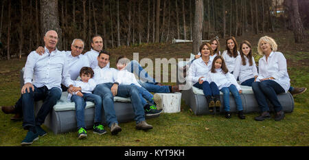 Family of many members, celebrating a party in the garden of their home Stock Photo