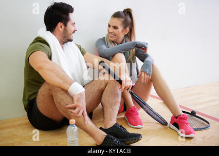 Squash players planning strategy game during short break Stock Photo