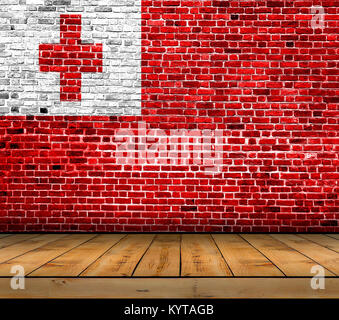 Tonga flag painted on brick wall with wooden floor Stock Photo