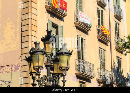 BARCELONA, SPAIN -  June 20, 2017 : example of a building facade in a residential area of the city where floats a Catalan flag on a summer day Stock Photo