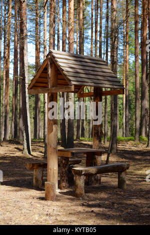 Wooden furniture for a picnic in the woods Stock Photo