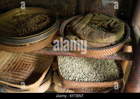 Different types of coffee beans on the plates Stock Photo