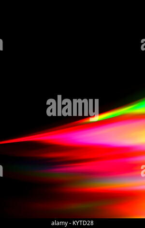 Beams of light refracting and creating a rainbow spectrum of colours against a black background Stock Photo
