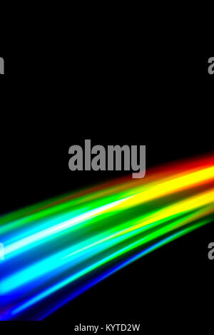 Beams of light refracting and creating a rainbow spectrum of colours against a black background Stock Photo