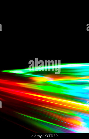 Beams of light refracting and creating a rainbow spectrum of colours against a black background Stock Photo