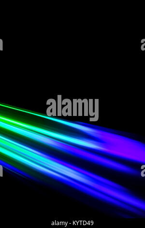 Beams of light refracting and creating a rainbow spectrum of colours against a black background Stock Photo