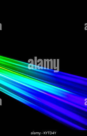 Beams of light refracting and creating a rainbow spectrum of colours against a black background Stock Photo