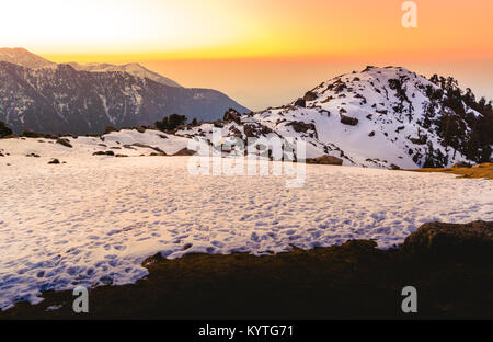 Tranquil Landscape of Sunset at Triund hill top at Mcleodganj, Dharamsala, Himachal pradesh, India. One of the most beautiful trekking places in India Stock Photo