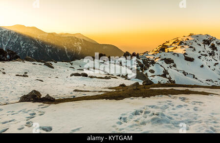 Amazing & Beautiful sunrise at Triund hill top at Mcleodganj, Dharamsala, Himachal pradesh, India. One of the most beautiful trekking places in India Stock Photo