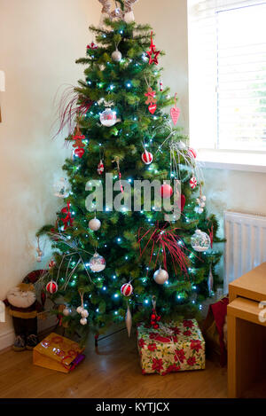 Christmas tree with lights and decorations, UK. Stock Photo