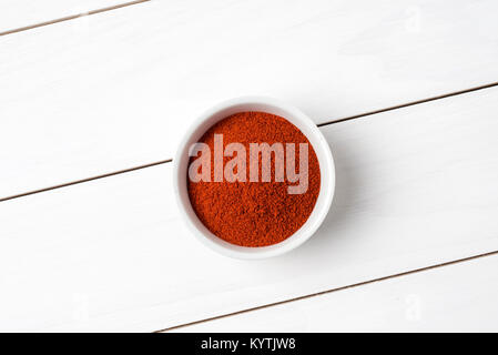 Paprika powder in white bowl. Close up Stock Photo