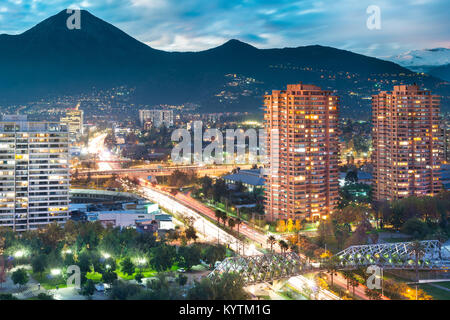 Elevated view of Las Condes district in Santiago de Chile and Manquehue Avenue with Manquehue hill in the back Stock Photo